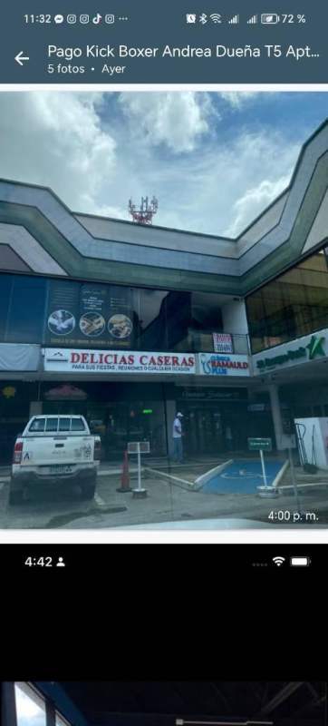 Front view of Plaza Mirage shopping center with signage, storefronts and parking area in Panama City