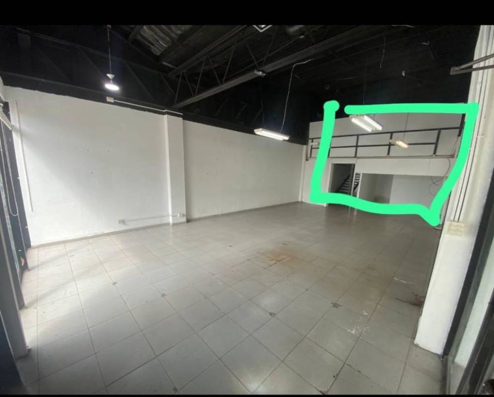 Open studio space featuring wall mirrors, mezzanine level and tiled flooring in Plaza Mirage Panama