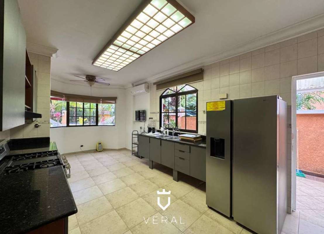 Spacious kitchen with granite countertops stainless appliances natural light Clayton Village