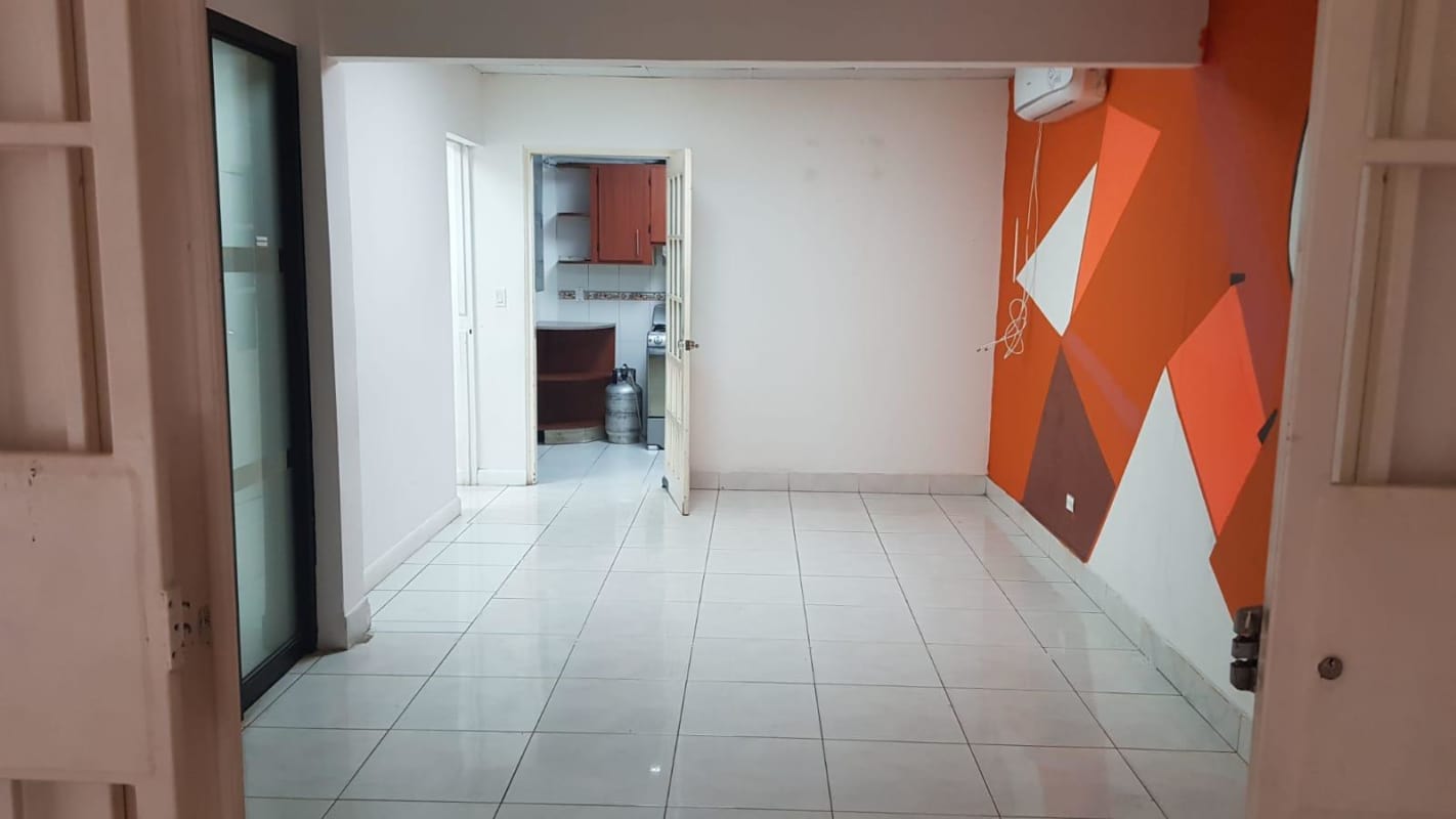 Modern lounge area with geometric accent wall and air conditioning Panama