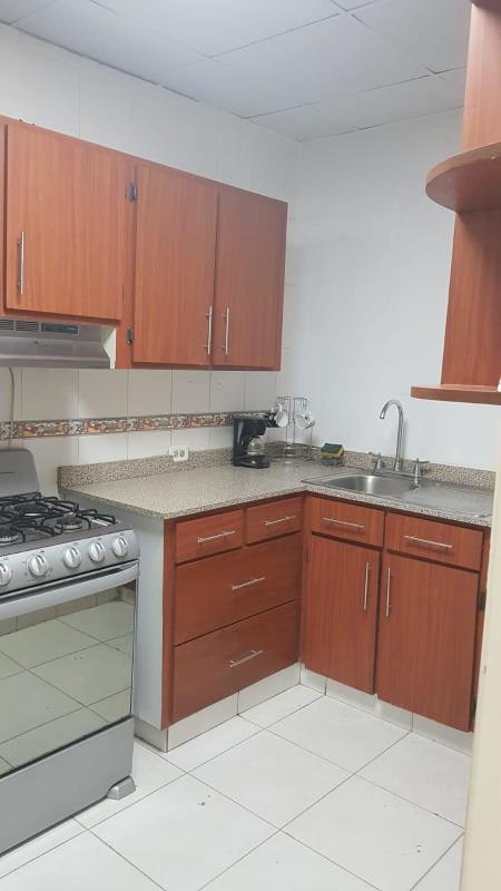 Small kitchenette with granite counters, stove, wood cabinets Los Ángeles Betania