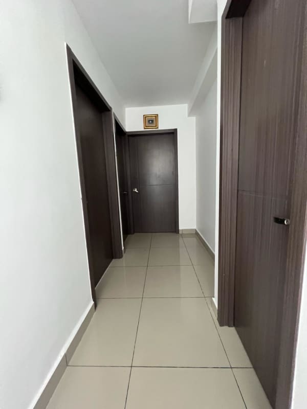 Furnished bedroom with tile floor and large window PH Luma Vista Hermosa Vista Hermosa