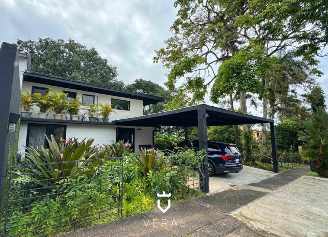 Modern bathroom with double vanity and walk-in shower in remodeled house Clayton Panama