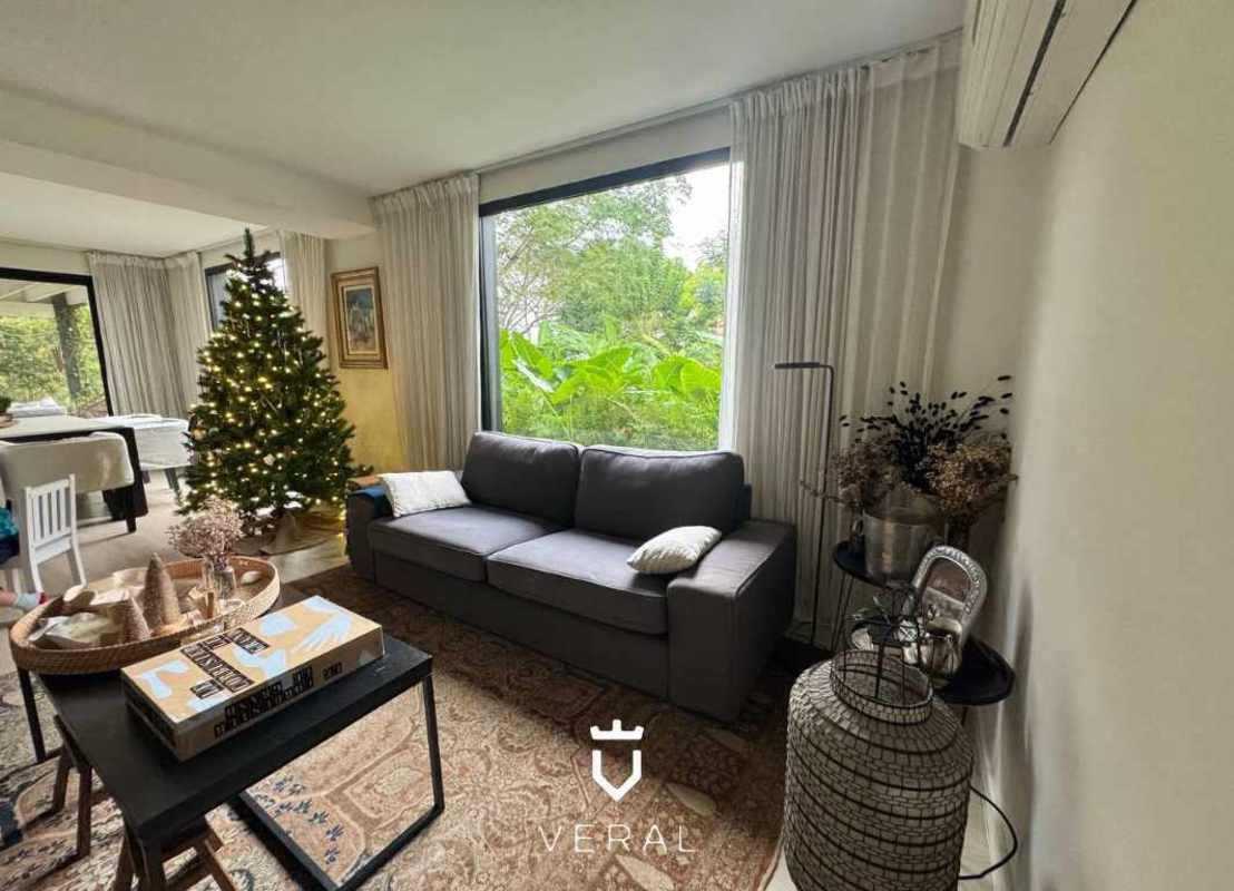 Covered terrace and BBQ in lush tropical garden with pool in Cardenas Village Clayton Panama