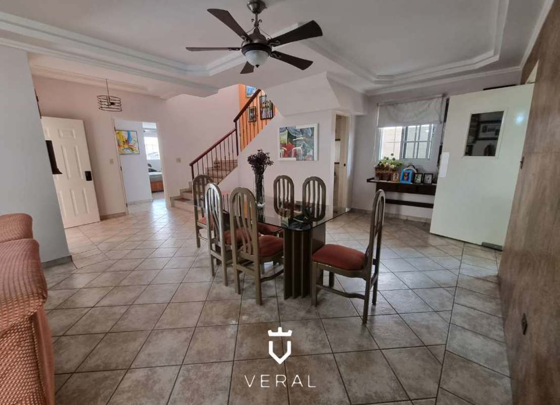 Elegant dining room with marble floors and access to living room in Altos de Panamá