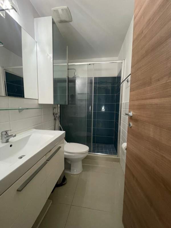 Bathroom glass enclosure, vanity sink, tiled walls apartment rental Panama