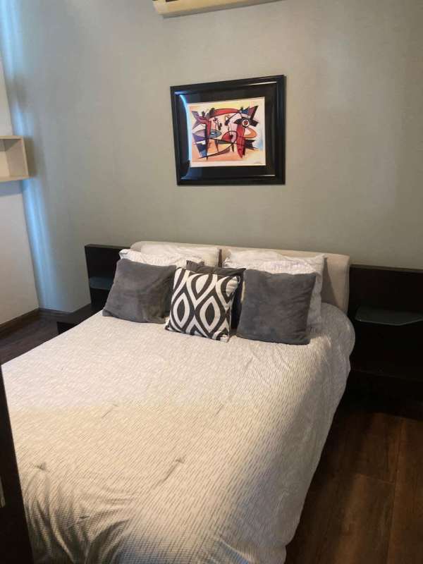 Bright bedroom with modern decor, AC unit, closet PH Galeria Uno apartment Panama City