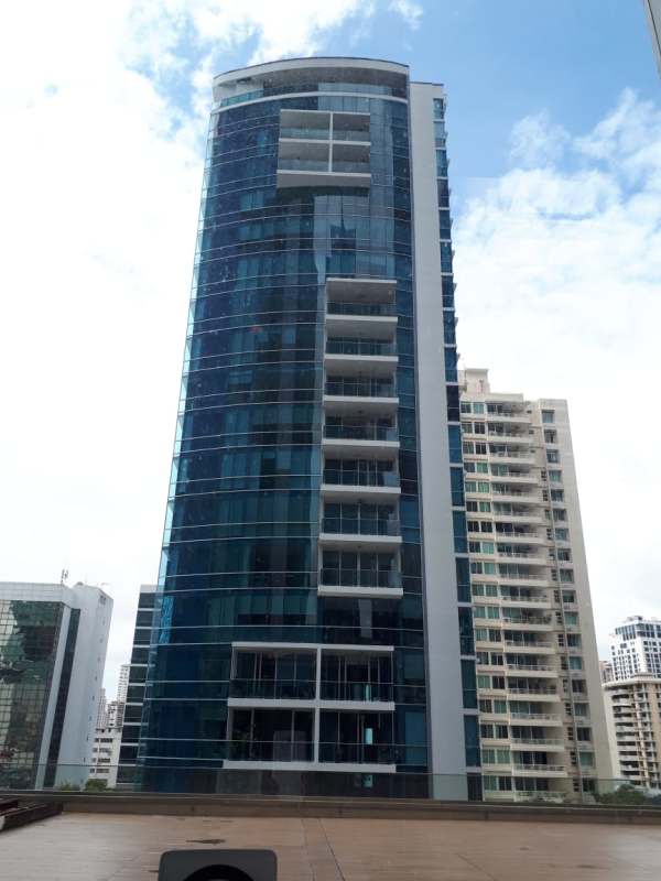 Facade of PH Galeria Uno high-rise condominium with glass balconies in Obarrio