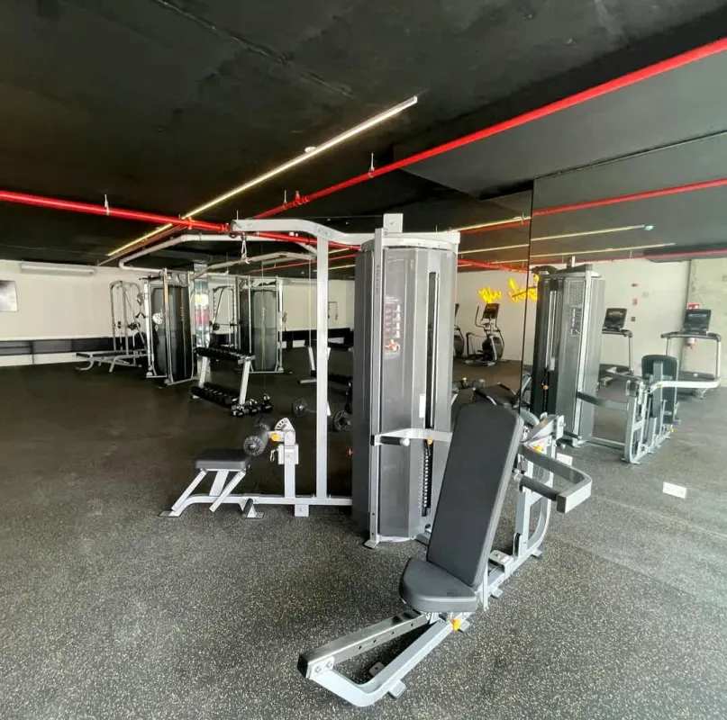 Contemporary fitness center with machines at Panamá Viejo Residences Panama