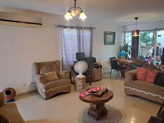 Living and dining area open concept with sofa dining table AC in La Chorrera Panama