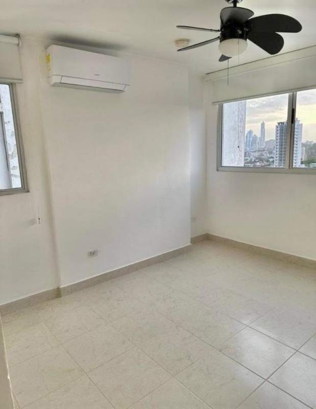 Bedroom with large windows city view tile flooring AC ceiling fan PH Central Park Panama
