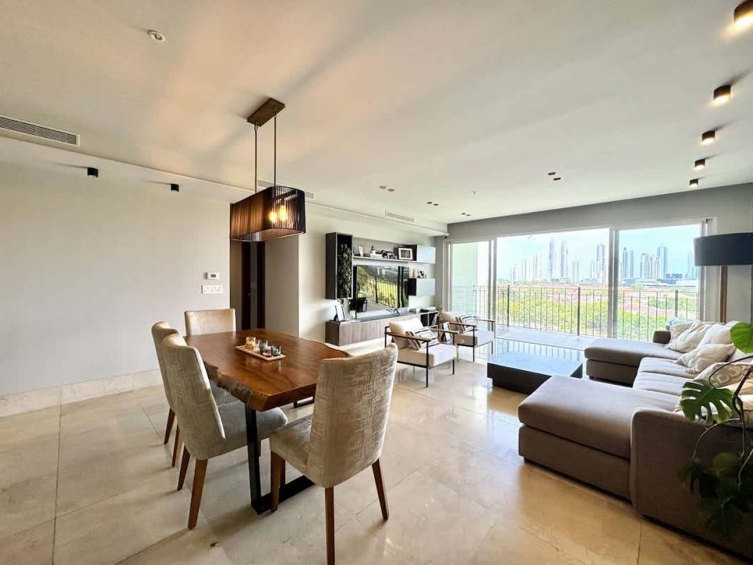 Aerial view of The Reserve condominiums within Santa María Golf & Country Club lush fairways and skyline