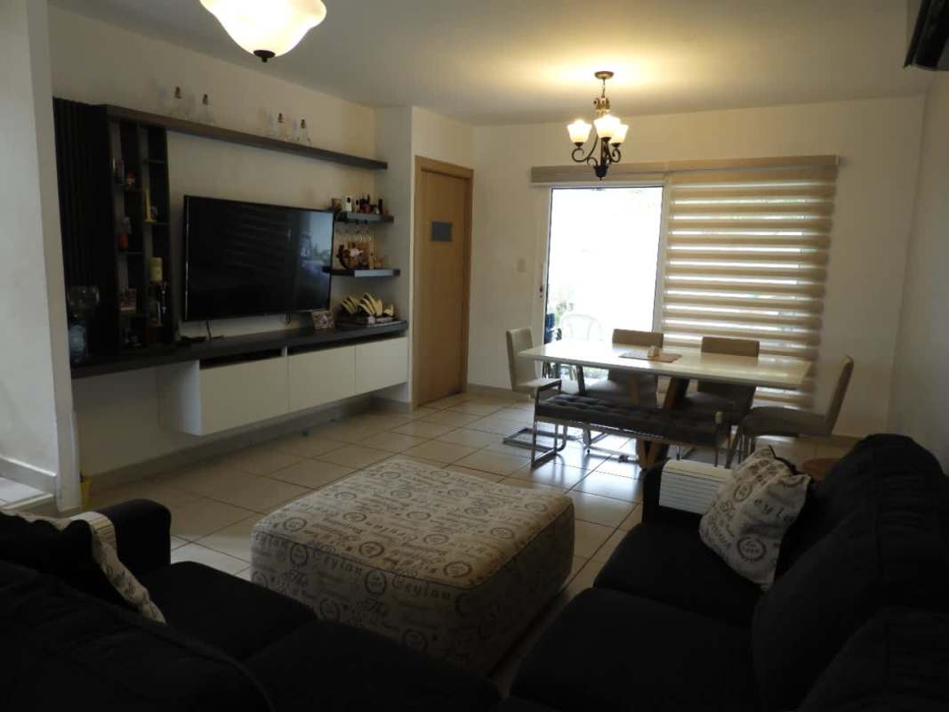 TV wall, floating shelves, tile floors in furnished rental in Brisas del Golf Panama