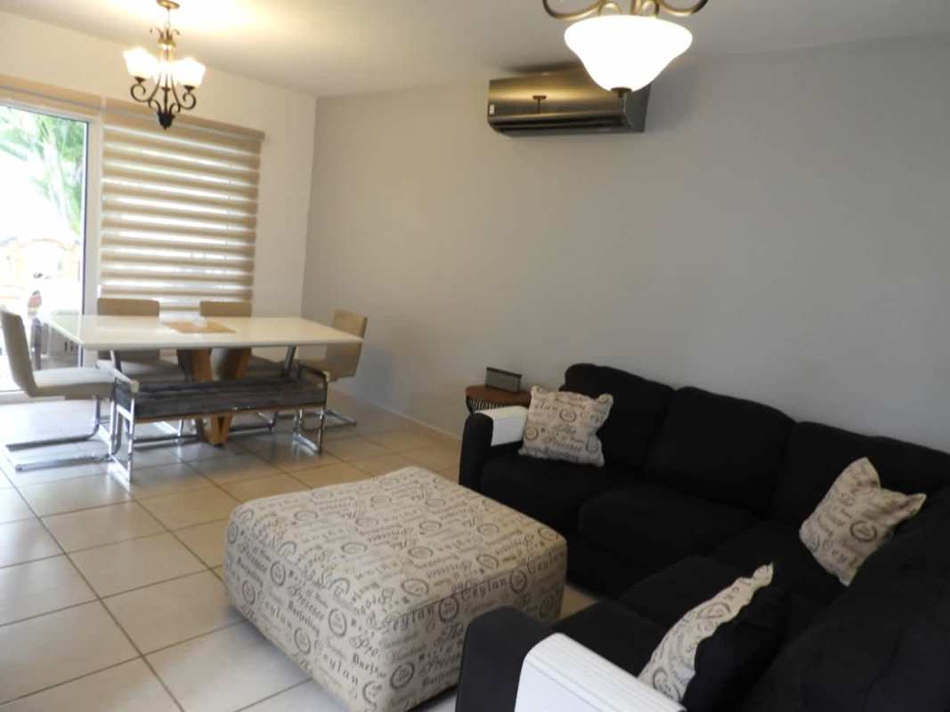 Sectional sofa, dining table, AC, window blinds in furnished home Brisas del Golf Panama