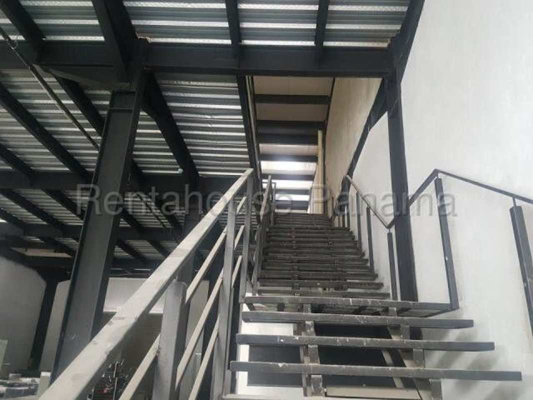 Entrance view with parking lots, security booth and commercial storage units in Panama City industrial complex