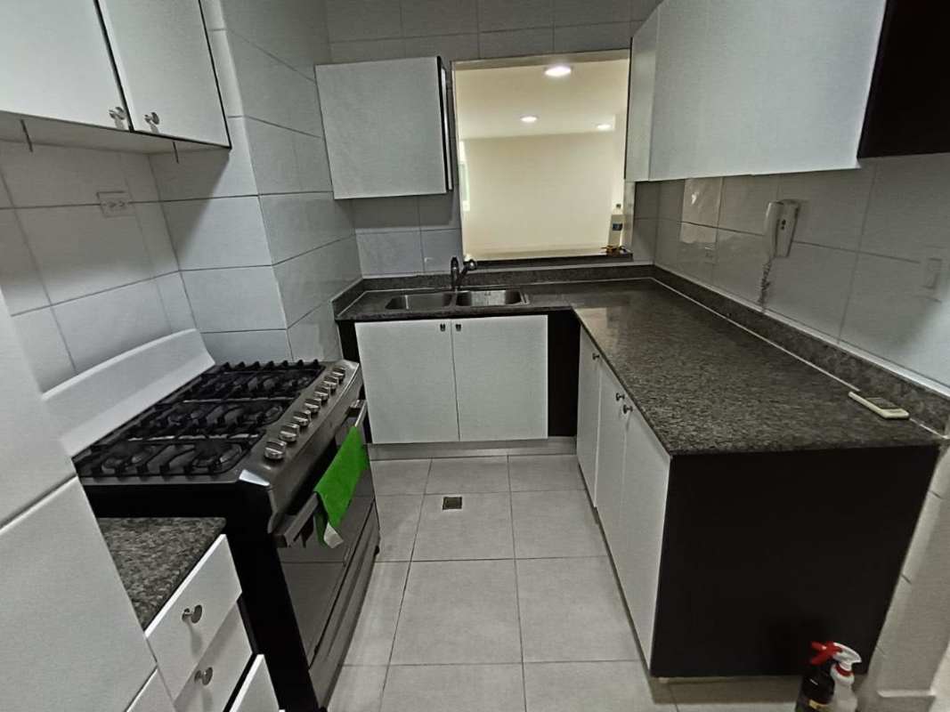 Laundry nook with stacked washer dryer hookup in kitchen PH Vivendi 400 Panama City