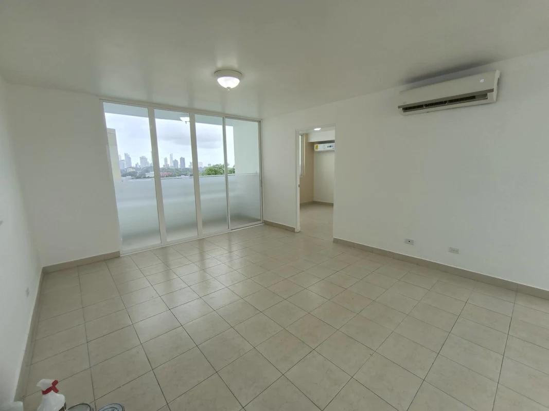 Bright living area sliding glass doors skyline view at PH Majestic Garden Panama