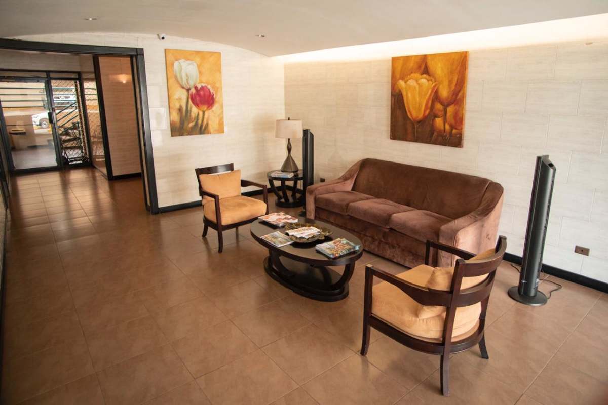 Compact equipped kitchen with appliances granite countertop in rental apartment Panama City