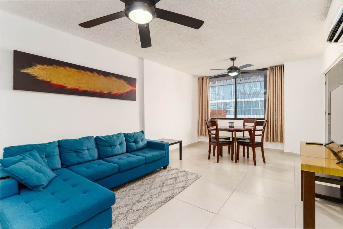 Tiled bathroom with shower, sink vanity mirror in rental apartment El Cangrejo Panama