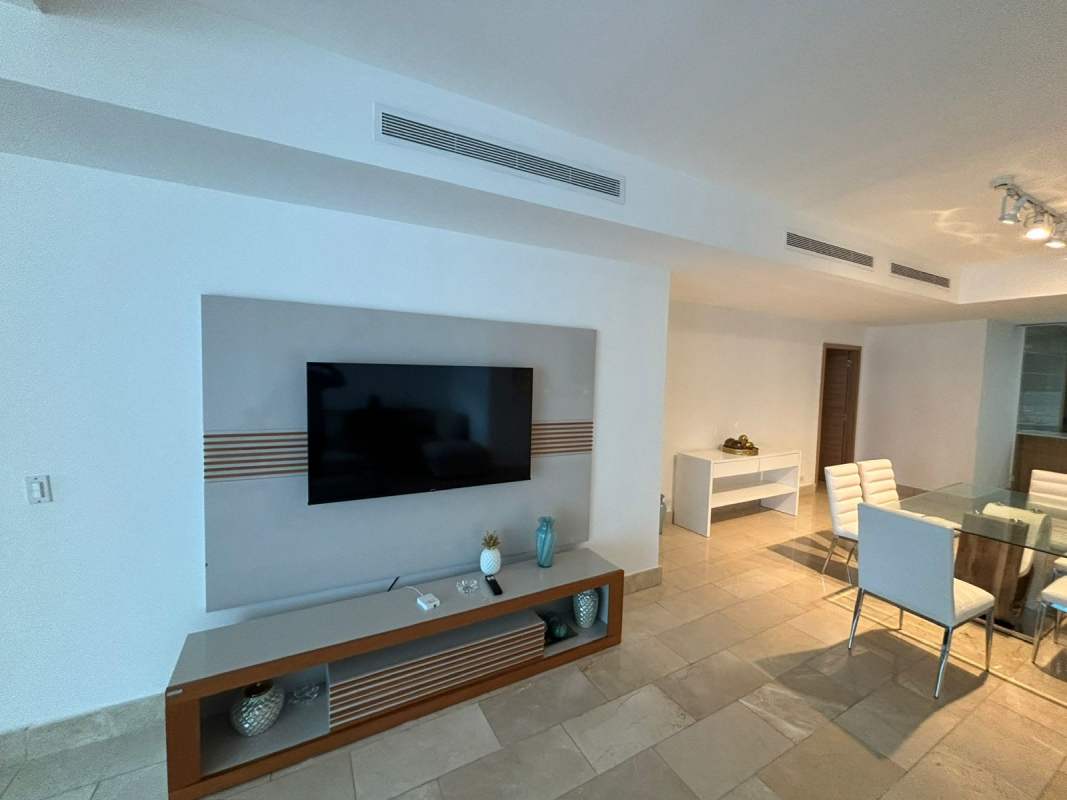Open plan living and dining with flat screen TV, recessed lighting at Grand Tower Punta Pacifica