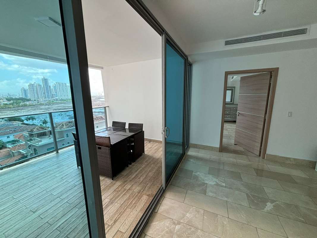 Private balcony overlooking Pacific Ocean and Panama City skyline at Grand Tower Punta Pacifica