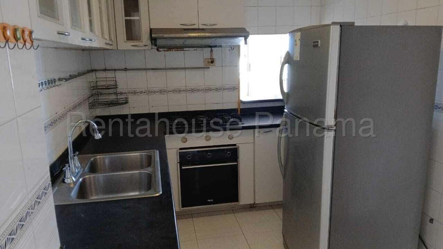 Covered social lounge area with tables and bar PH Terrace El Cangrejo apartment complex Panama