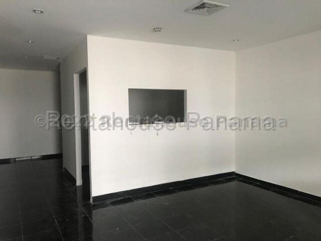 Empty commercial retail interior space with tiled flooring and cut-out wall at Plaza Milla 8 in Milla 8 Panama