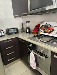 Modern bathroom with glass shower enclosure in PH Mosaic Panama Pacifico