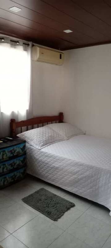 Bedroom with air conditioner, wood-paneled ceiling, single bed Las Praderas San Antonio rental