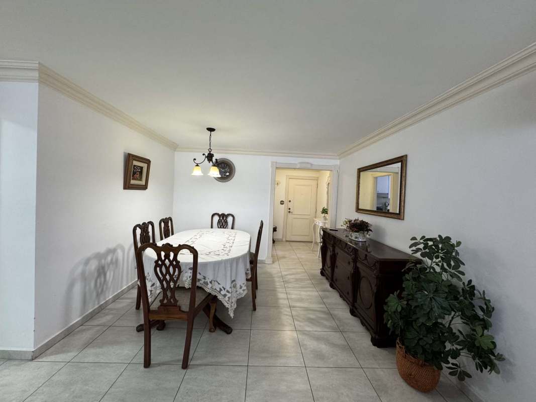 Combined living and dining room traditional style with ample lighting in Marbella apartment rental