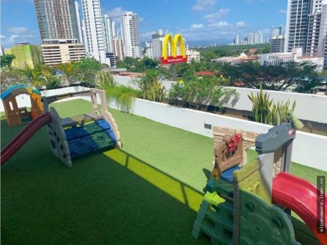 Bedroom furnished with bed, closet, large windows and city view at Coco del Mar Panama apartment