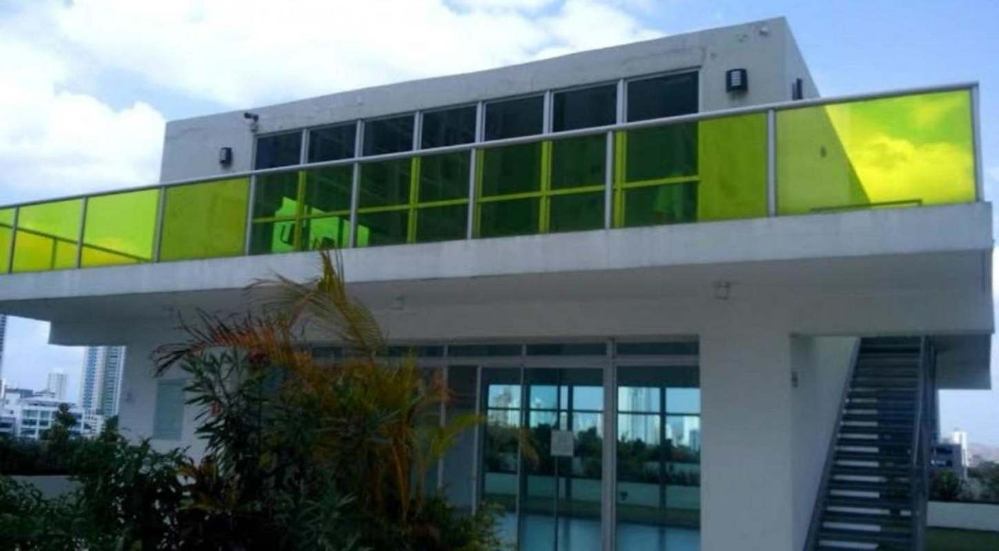 Spacious living and dining area with large windows and balcony access in PH Coco del Mar apartment