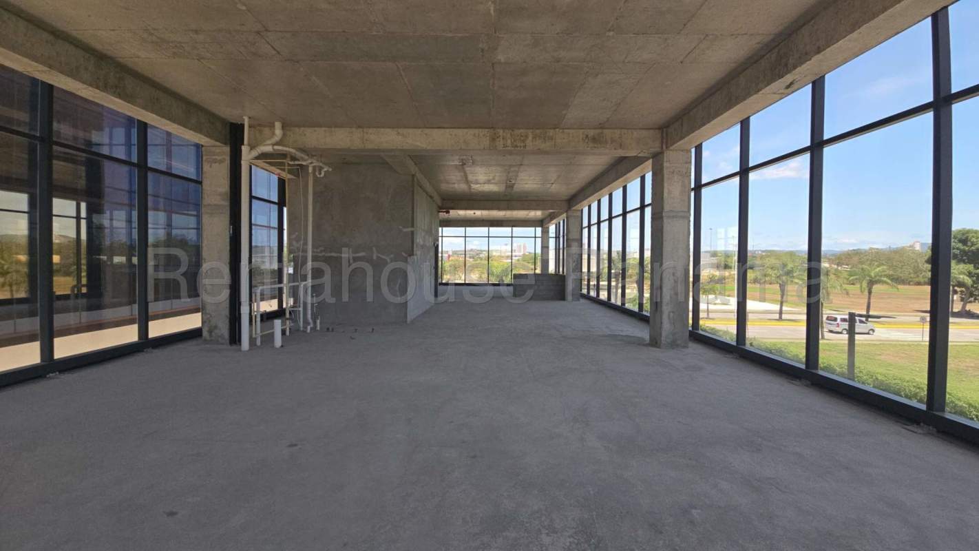 Interior of commercial space with panoramic floor-to-ceiling windows at Santa Maria corporate boutique building