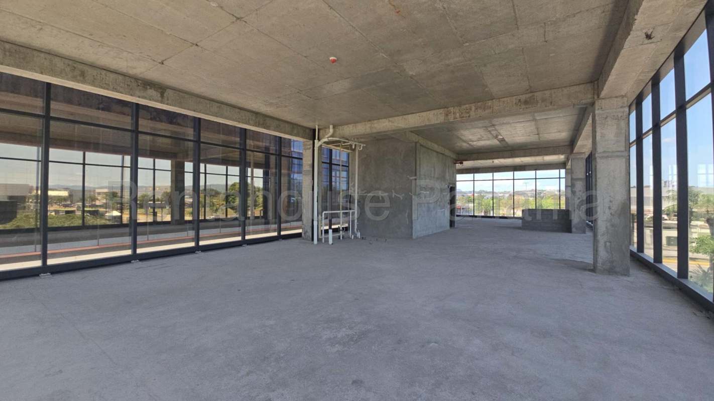 Unfinished modern industrial office design with high ceilings and panoramic windows boutique corporate building Panama