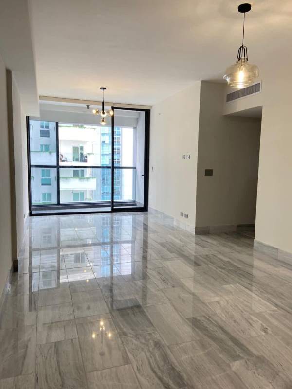 Modern bedroom with large windows, downtown skyline views, marble tiles in PH Nuovo Residences Bella Vista Panama