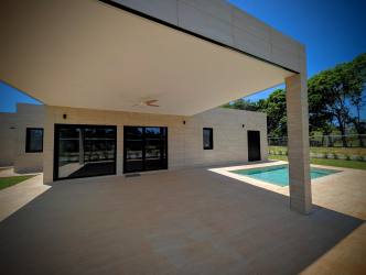 Open plan living and dining with modern kitchen light flooring Pedasi Panama