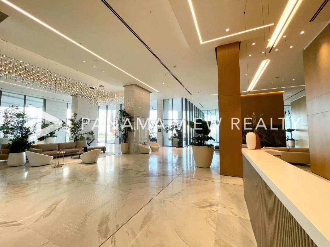 Elegant master bathroom with marble double sinks, glass shower, panoramic window in Seapoint Punta Paitilla Panama