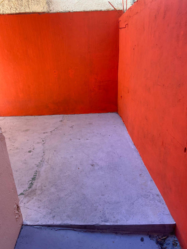 Enclosed small concrete patio area in PH Parque Lefevre Panama apartment complex