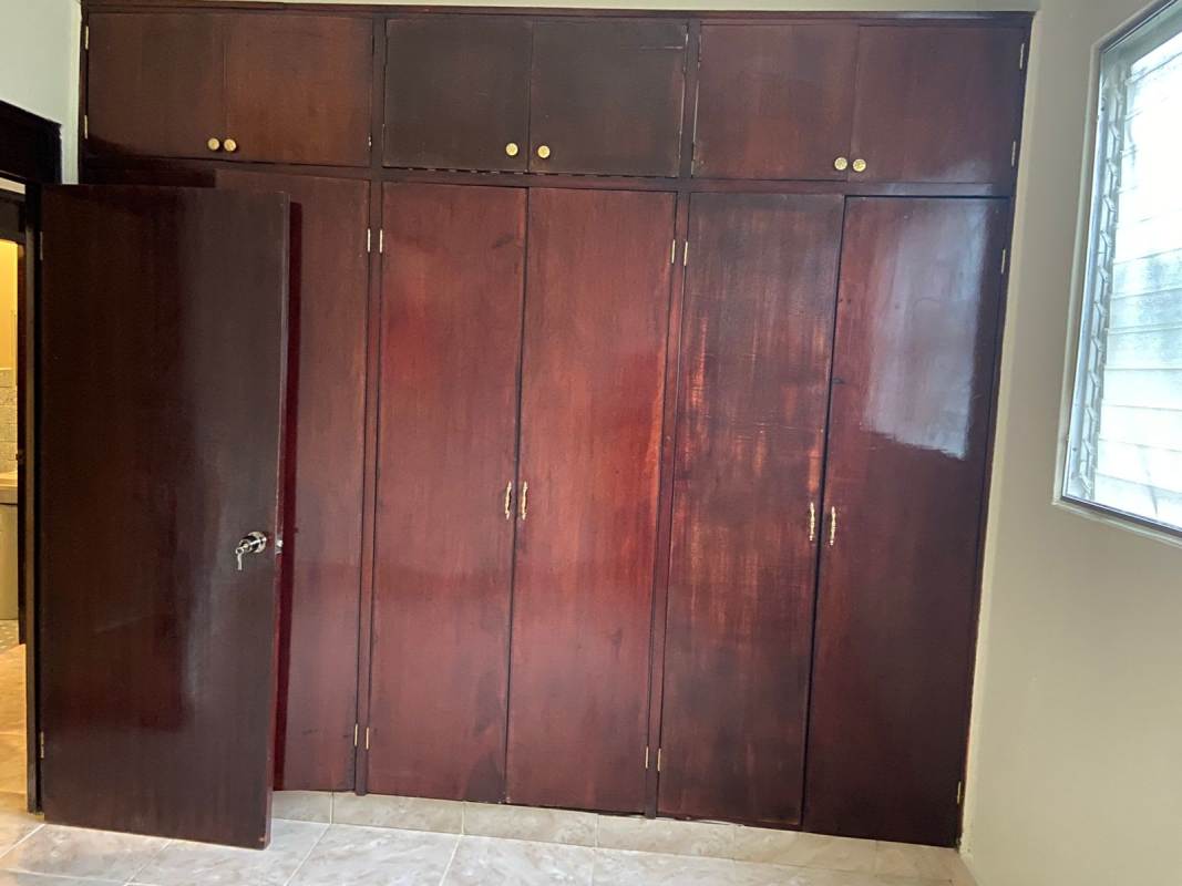 Bright bedroom with tiled floor and security windows in PH Parque Lefevre Panama