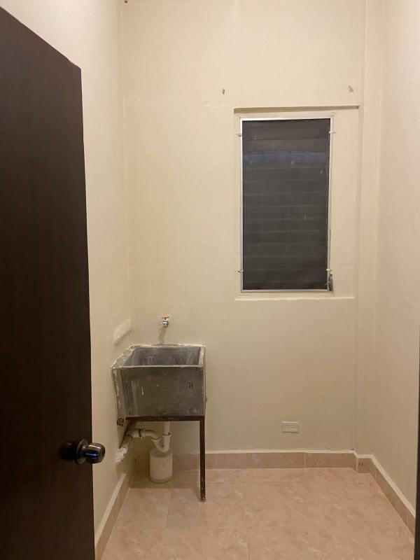 Vintage kitchen with blue tiles and white cabinets in PH Parque Lefevre Panama City