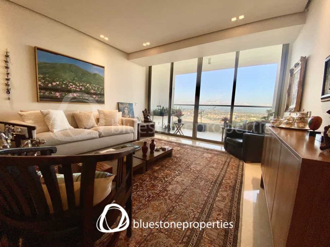 Living room with large windows overlooking golf course in PH Greenview Residences Santa Maria Panama