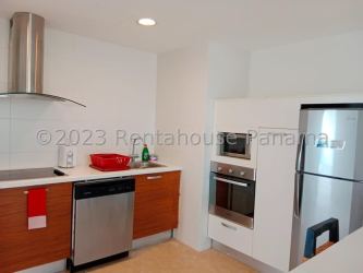 Bedroom with two double beds, large window with pool views at Nikki Beach Residences Panama