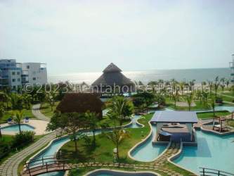 Private terrace with seating and views of giant saltwater pool and ocean at Playa Blanca Panama