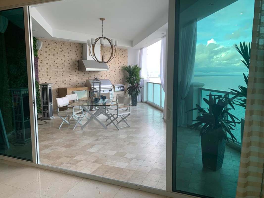 Spacious balcony with glass railing, sea view, outdoor BBQ kitchen in Venetian Tower Punta Pacífica Panama