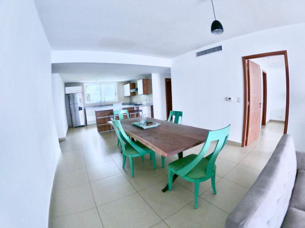 Modern kitchen with granite counters, stainless appliances, window view PH Amador Heights Panama