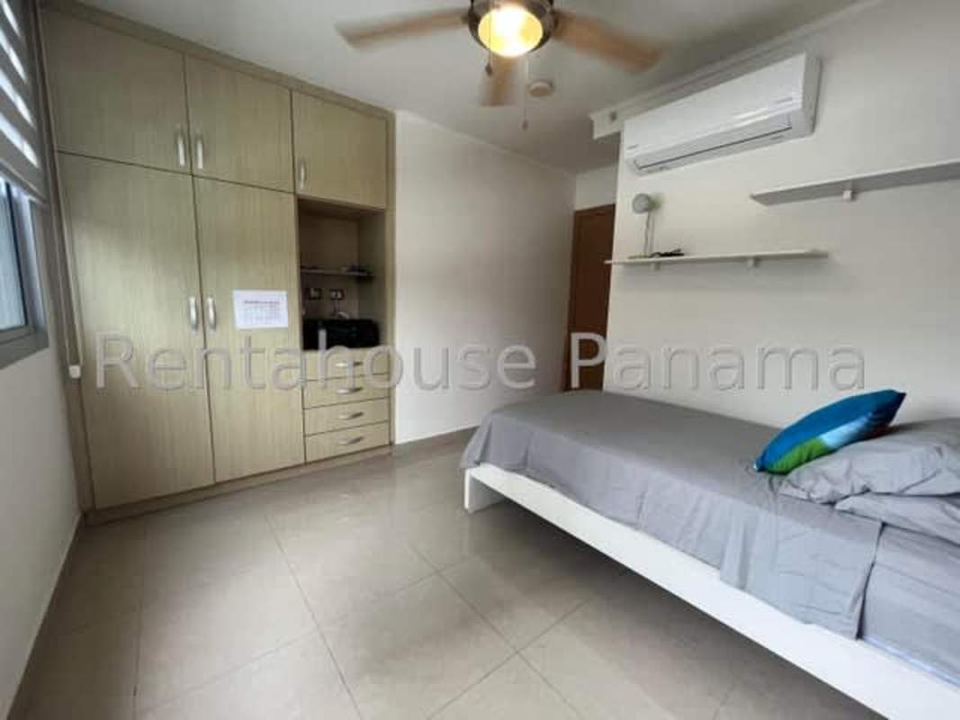 Bedroom with built-in wardrobe, AC, and single bed PH Rokas Condado del Rey Panama