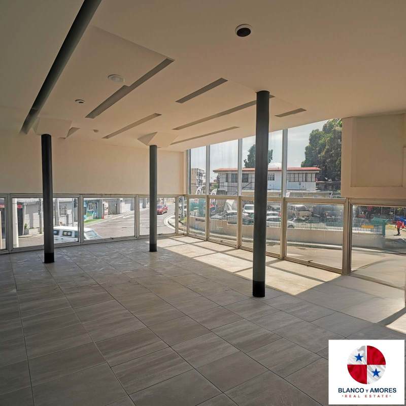 Spacious empty office with large glass windows, modern ceiling and ample natural light in Costa Sur Panama