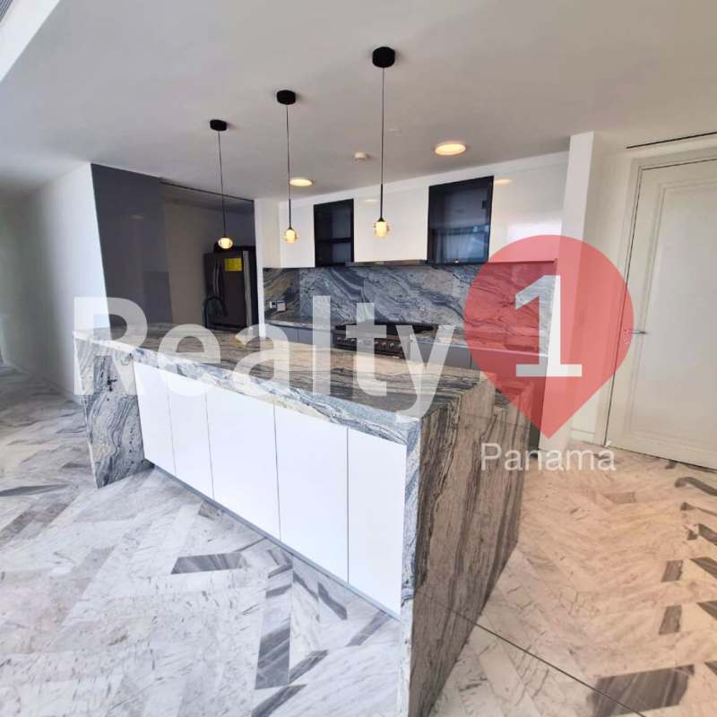 Contemporary kitchen with marble waterfall island, pendant lighting, and city views in PH Wanders & Yoo Panama