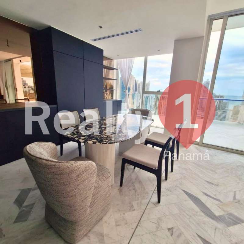 High-rise dining area with marble table, city and ocean views PH Wanders & Yoo Panama