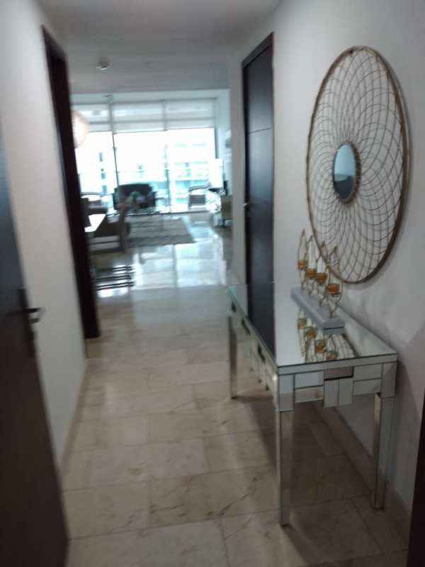 Spacious living area with floor to ceiling windows and balcony ocean views Grand Tower Punta Pacifica Panama